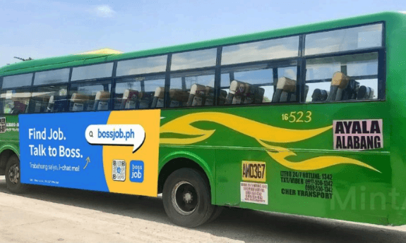 Bossjob bus-side advertisement on a green commuter bus in Metro Manila